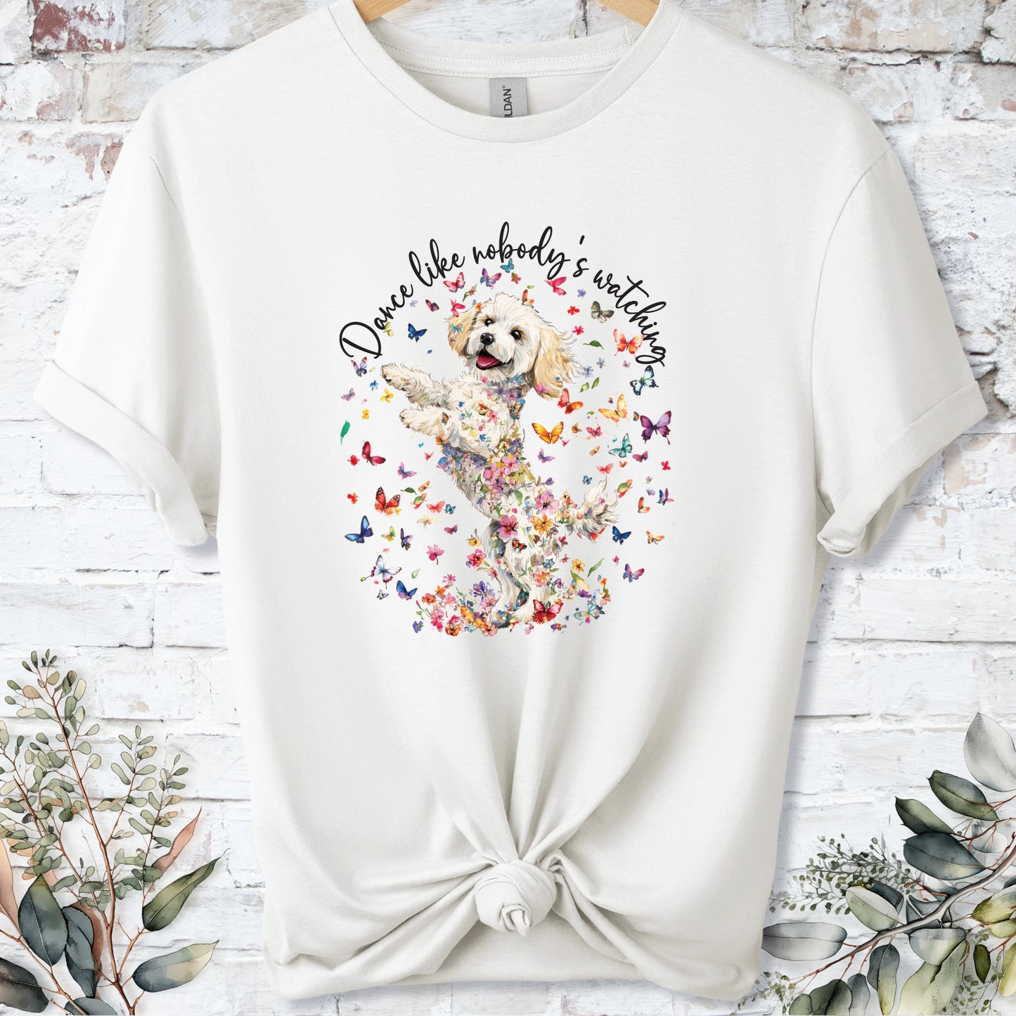 https://wescale-cdn.com/generated-mockups/bf472b68-5c1c-44c3-a409-4b955cabfa92/69acafd1-585e-4806-952c-4f06a54c82f8/3e8a5956-7015-46e5-b1dc-8a0d0bd2176b_designs/cavichon_3_dance_like_nobody_s_watching_unisex_t_shirt_2_1777545722878_96bo18.png_1777545723941.webp