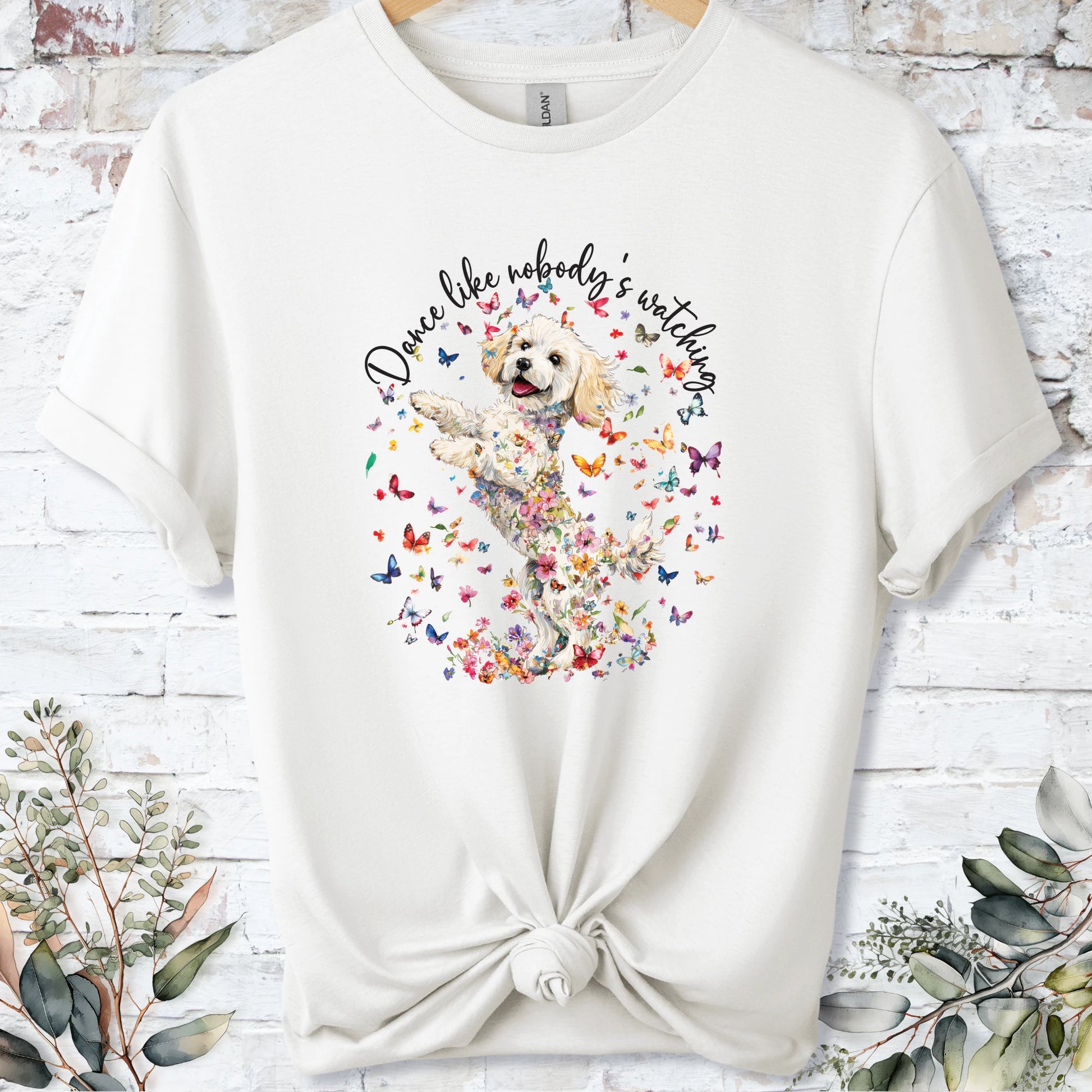 https://wescale-cdn.com/generated-mockups/bf472b68-5c1c-44c3-a409-4b955cabfa92/69acafd1-585e-4806-952c-4f06a54c82f8/3e8a5956-7015-46e5-b1dc-8a0d0bd2176b_designs/cavichon_3_dance_like_nobody_s_watching_unisex_t_shirt_2_1777545722878_96bo18.png_1777545723941.webp