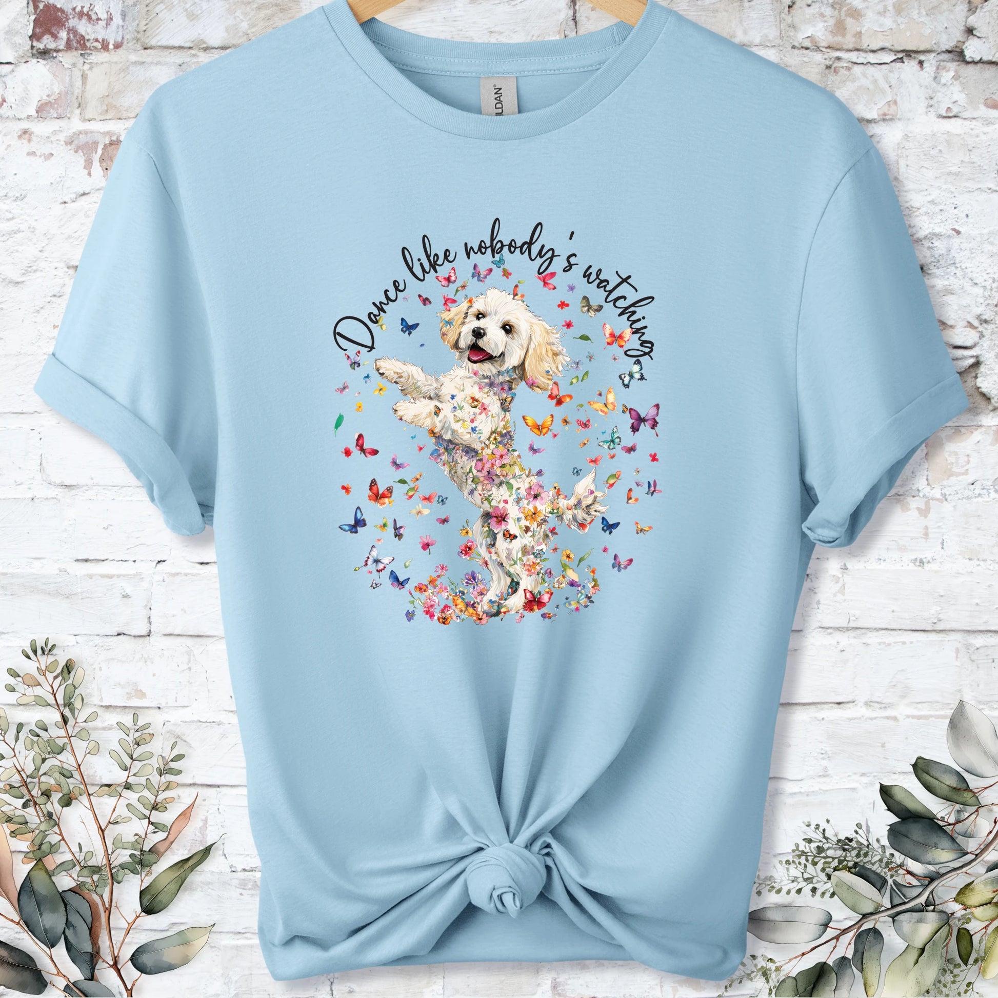 https://wescale-cdn.com/generated-mockups/bf472b68-5c1c-44c3-a409-4b955cabfa92/69acafd1-585e-4806-952c-4f06a54c82f8/954a667b-f3c9-43d0-badc-0388c4840f13_designs/cavichon_3_dance_like_nobody_s_watching_unisex_t_shirt_2_1777545722878_96bo18.png_1777545723941.webp