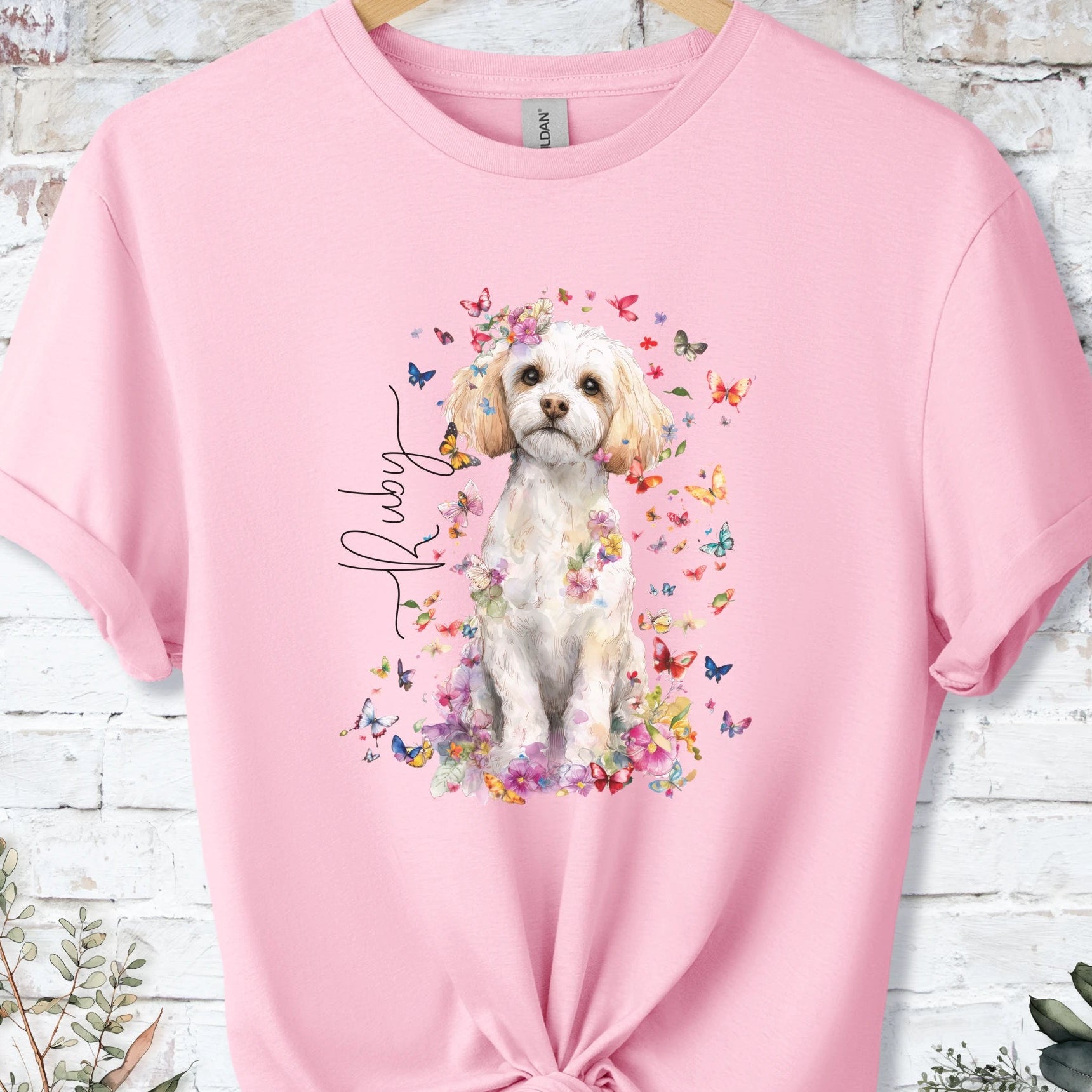 https://wescale-cdn.com/generated-mockups/bf472b68-5c1c-44c3-a409-4b955cabfa92/69acafd1-585e-4806-952c-4f06a54c82f8/37dc3834-33f9-47c9-b73e-9085ff95e0d1_designs/cavichon_flora_personalised_unisex_t_shirt_2_1777545755472_kd08h5.png_1777545756612.webp