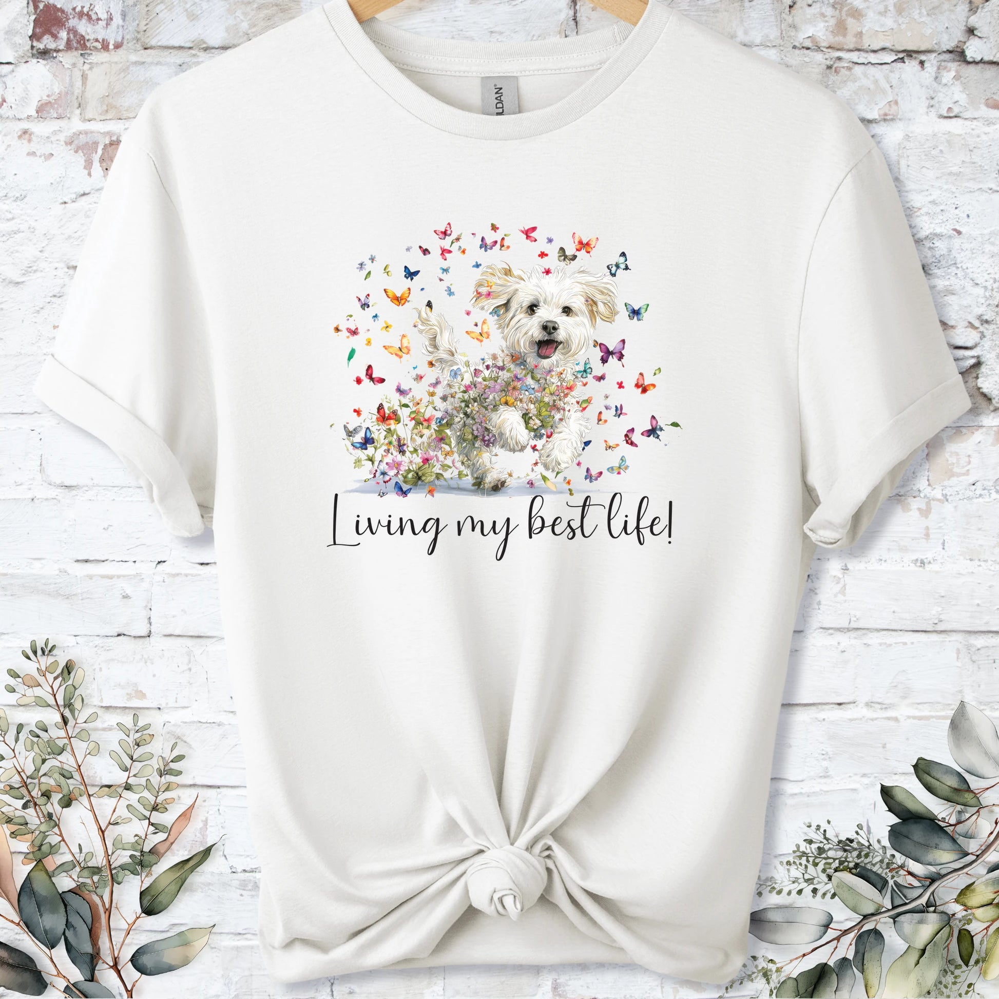 https://wescale-cdn.com/generated-mockups/bf472b68-5c1c-44c3-a409-4b955cabfa92/69acafd1-585e-4806-952c-4f06a54c82f8/3e8a5956-7015-46e5-b1dc-8a0d0bd2176b_designs/cavichon_living_my_best_life_2_unisex_t_shirt_2_1777545970919_en9ugv.png_1777545972173.webp