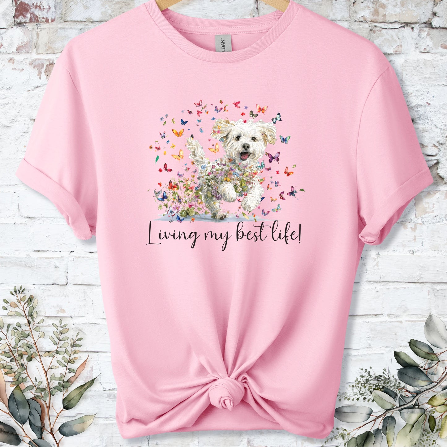 https://wescale-cdn.com/generated-mockups/bf472b68-5c1c-44c3-a409-4b955cabfa92/69acafd1-585e-4806-952c-4f06a54c82f8/37dc3834-33f9-47c9-b73e-9085ff95e0d1_designs/cavichon_living_my_best_life_2_unisex_t_shirt_2_1777545970919_en9ugv.png_1777545972173.webp
