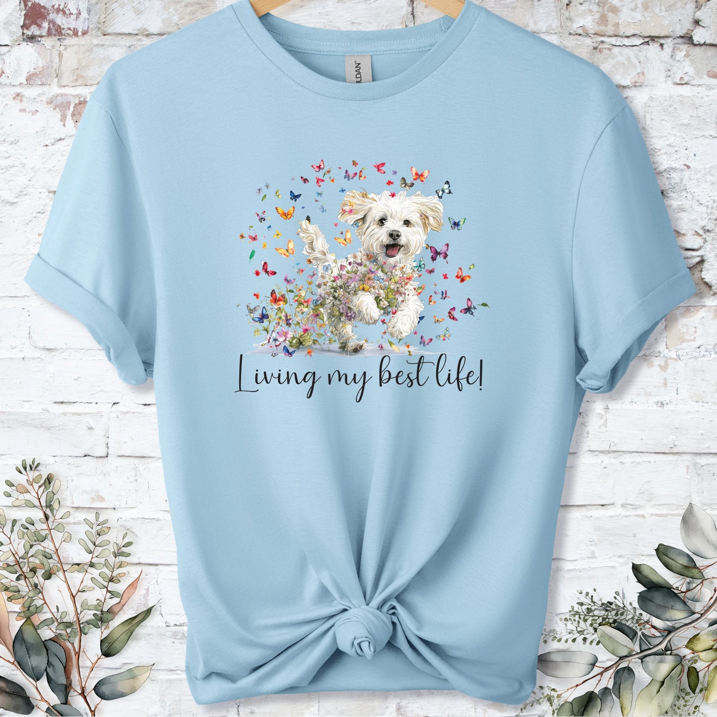 https://wescale-cdn.com/generated-mockups/bf472b68-5c1c-44c3-a409-4b955cabfa92/69acafd1-585e-4806-952c-4f06a54c82f8/954a667b-f3c9-43d0-badc-0388c4840f13_designs/cavichon_living_my_best_life_2_unisex_t_shirt_2_1777545970919_en9ugv.png_1777545972173.webp