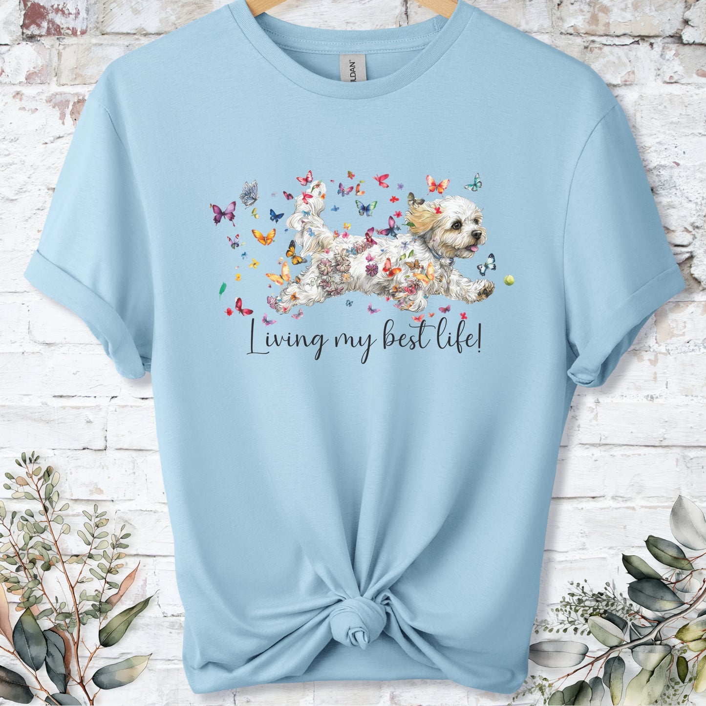 https://wescale-cdn.com/generated-mockups/bf472b68-5c1c-44c3-a409-4b955cabfa92/69acafd1-585e-4806-952c-4f06a54c82f8/954a667b-f3c9-43d0-badc-0388c4840f13_designs/cavichon_living_my_best_life_unisex_t_shirt_2_1777545882683_mth4ps.png_1777545883665.webp