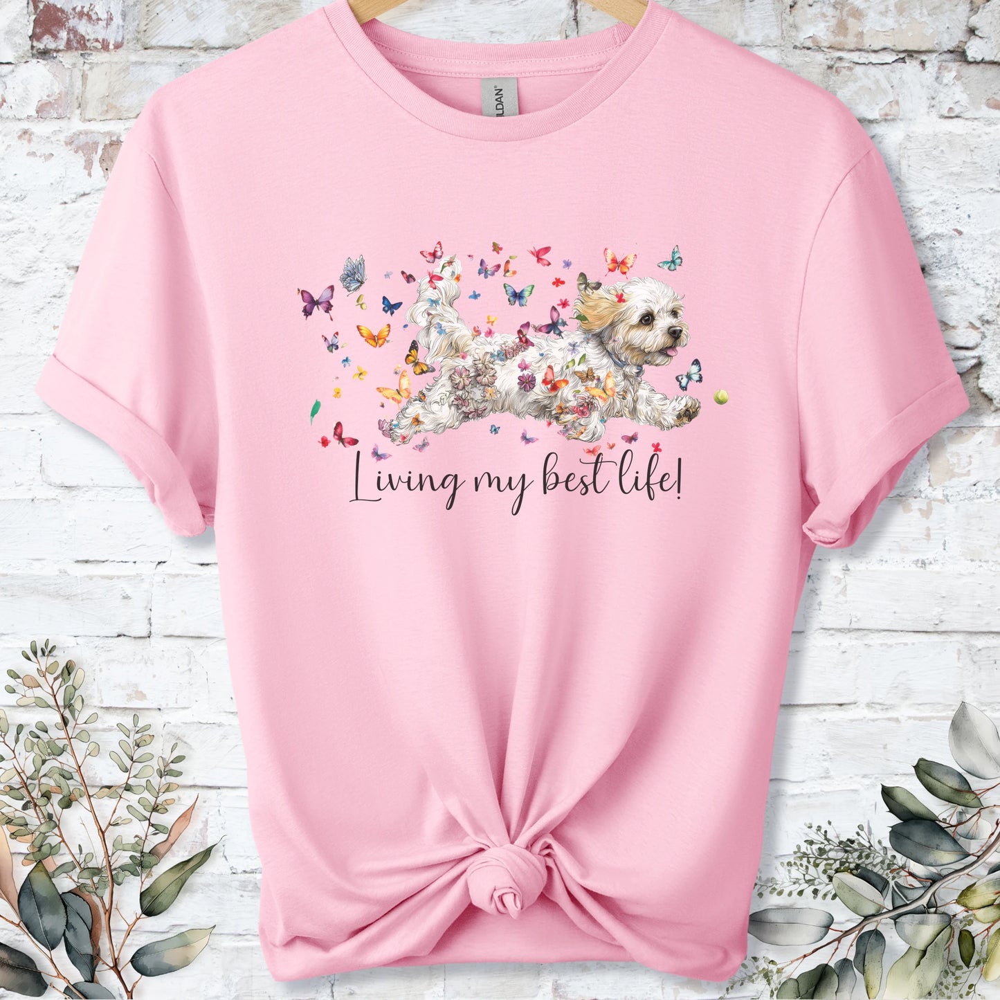https://wescale-cdn.com/generated-mockups/bf472b68-5c1c-44c3-a409-4b955cabfa92/69acafd1-585e-4806-952c-4f06a54c82f8/37dc3834-33f9-47c9-b73e-9085ff95e0d1_designs/cavichon_living_my_best_life_unisex_t_shirt_2_1777545882683_mth4ps.png_1777545883665.webp