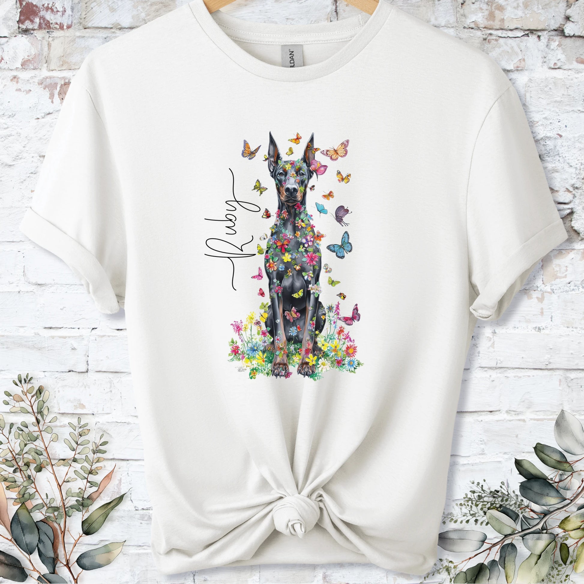 https://wescale-cdn.com/generated-mockups/bf472b68-5c1c-44c3-a409-4b955cabfa92/533a35f1-5739-476c-9eba-37ec84cbbba2/3e8a5956-7015-46e5-b1dc-8a0d0bd2176b_designs/doberman_pinscher_8_floral_butterfly_personalised_t_shirt_2_1777074792388_1qicuf.png_1777074795305.webp