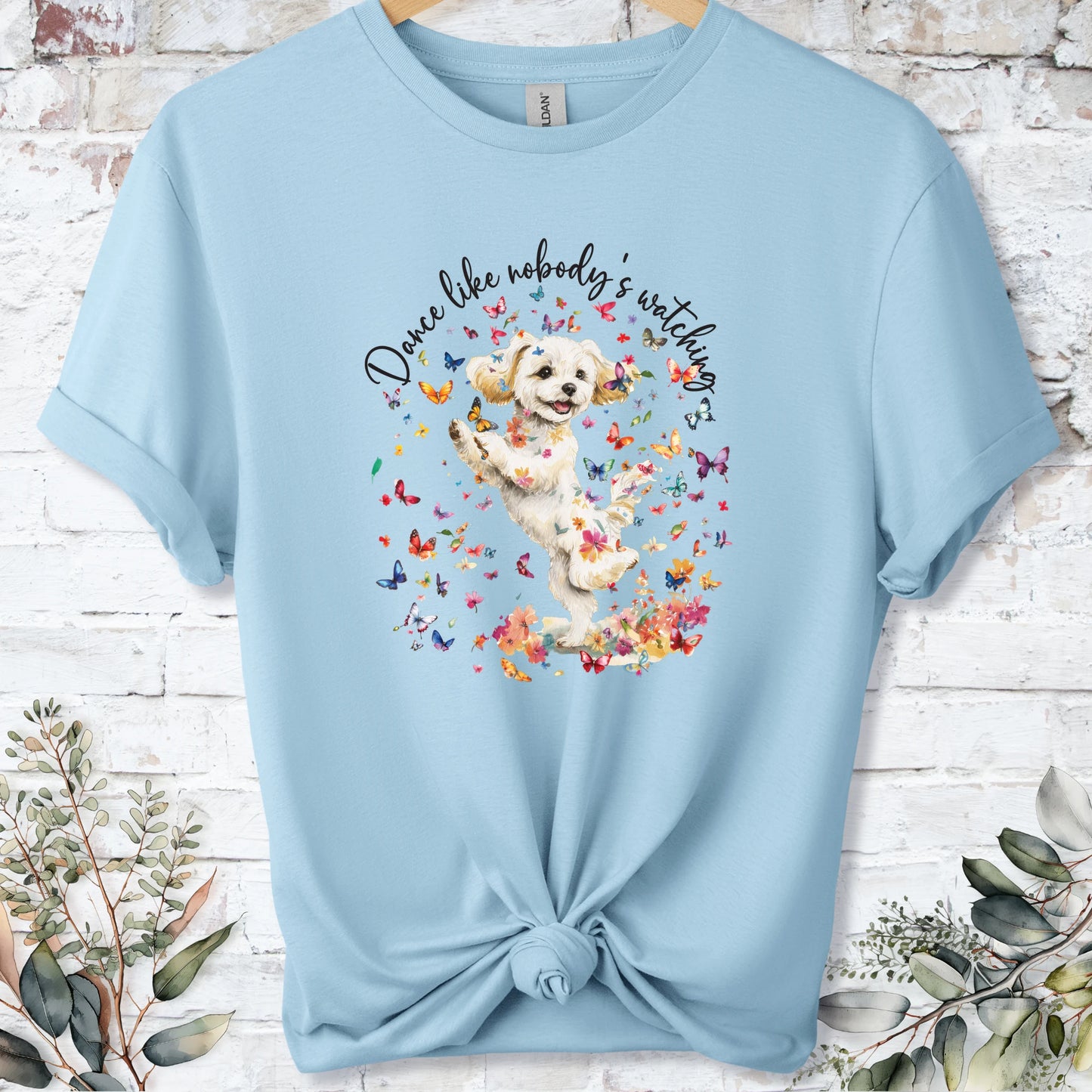 https://wescale-cdn.com/generated-mockups/bf472b68-5c1c-44c3-a409-4b955cabfa92/69acafd1-585e-4806-952c-4f06a54c82f8/954a667b-f3c9-43d0-badc-0388c4840f13_designs/maltese_2_dance_like_nobody_s_watching_unisex_t_shirt_2_1777545846776_ywuo0g.png_1777545848162.webp