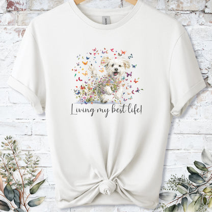 https://wescale-cdn.com/generated-mockups/bf472b68-5c1c-44c3-a409-4b955cabfa92/69acafd1-585e-4806-952c-4f06a54c82f8/3e8a5956-7015-46e5-b1dc-8a0d0bd2176b_designs/maltese_living_my_best_life_2_unisex_t_shirt_2_1777545790833_1vlrjs.png_1777545793187.webp
