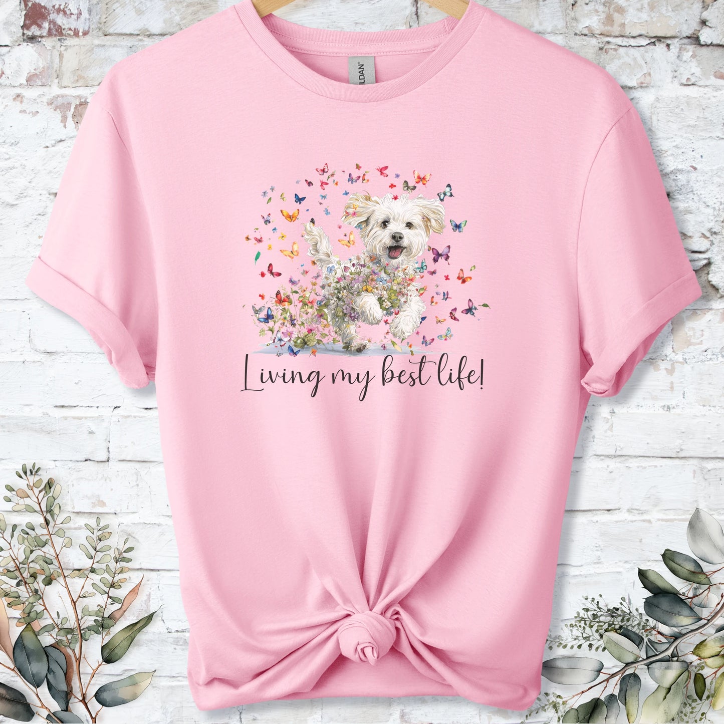 https://wescale-cdn.com/generated-mockups/bf472b68-5c1c-44c3-a409-4b955cabfa92/69acafd1-585e-4806-952c-4f06a54c82f8/37dc3834-33f9-47c9-b73e-9085ff95e0d1_designs/maltese_living_my_best_life_2_unisex_t_shirt_2_1777545790833_1vlrjs.png_1777545793187.webp